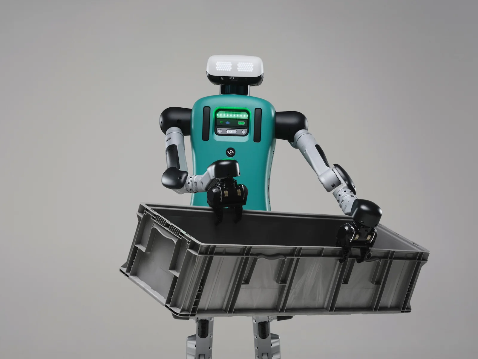 Agility Robotics Digit humanoid holding a grey tote
